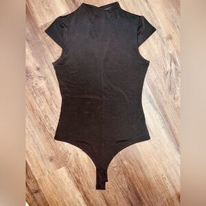 Lulu’s Black High Neck Bodysuit